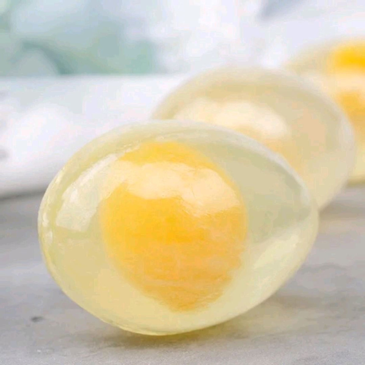 Collagen egg soap with gold hexagonal packaging