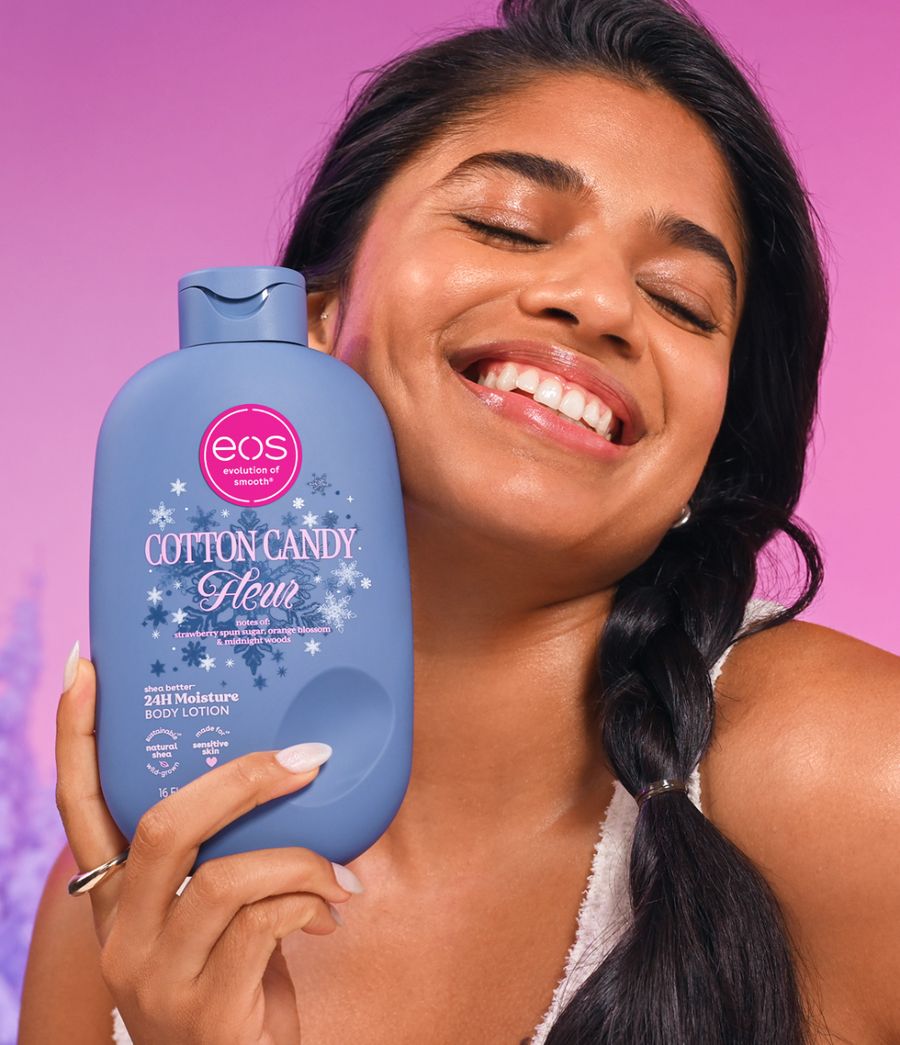 Woman holding EOS Cotton Candy Fleur Body Lotion