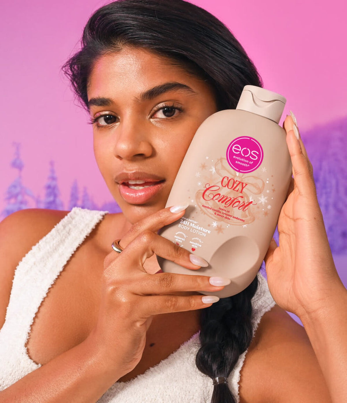 Woman holding EOS Cozy Comfort lotion