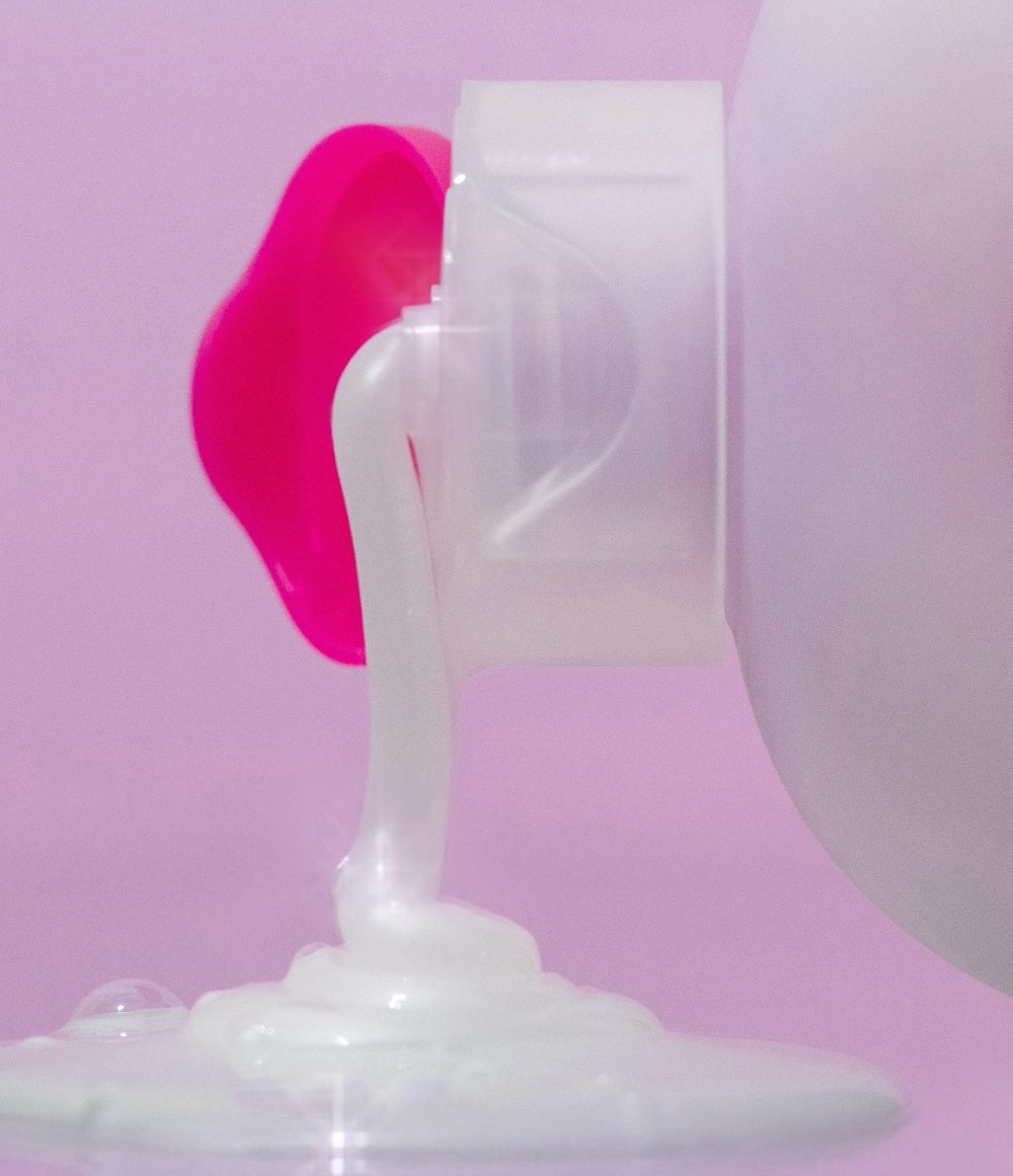 EOS Coconut Waters Body Wash creamy gel texture poured from the bottle