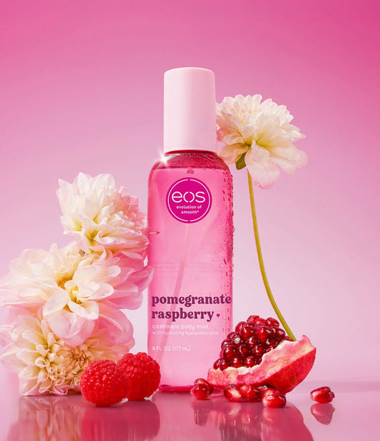 HAMYNAT eos pomegranate raspberry cashmere body mist in a pink spray bottle surrounded by fresh fruit and flowers