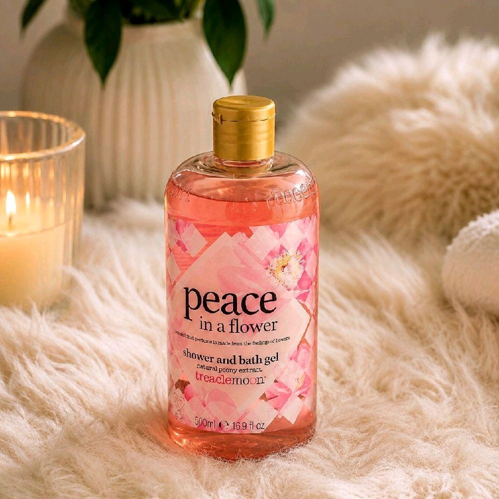 HAMYNAT Treaclemoon Peace in a Flower shower and bath gel in a clear bottle with pink floral label on faux fur rug