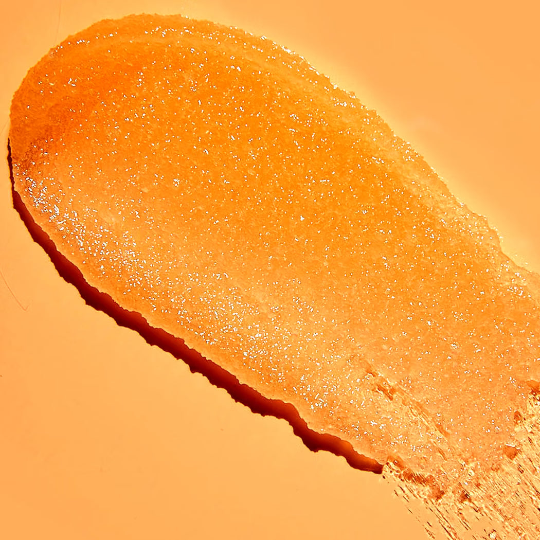 HAMYNAT Tree Hut Papaya Paradise shea sugar scrub texture showing vibrant orange exfoliating grains on a smooth surface