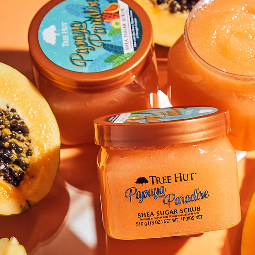 HAMYNAT Tree Hut Papaya Paradise Shea Sugar Scrub in orange jars surrounded by fresh papaya fruit slices