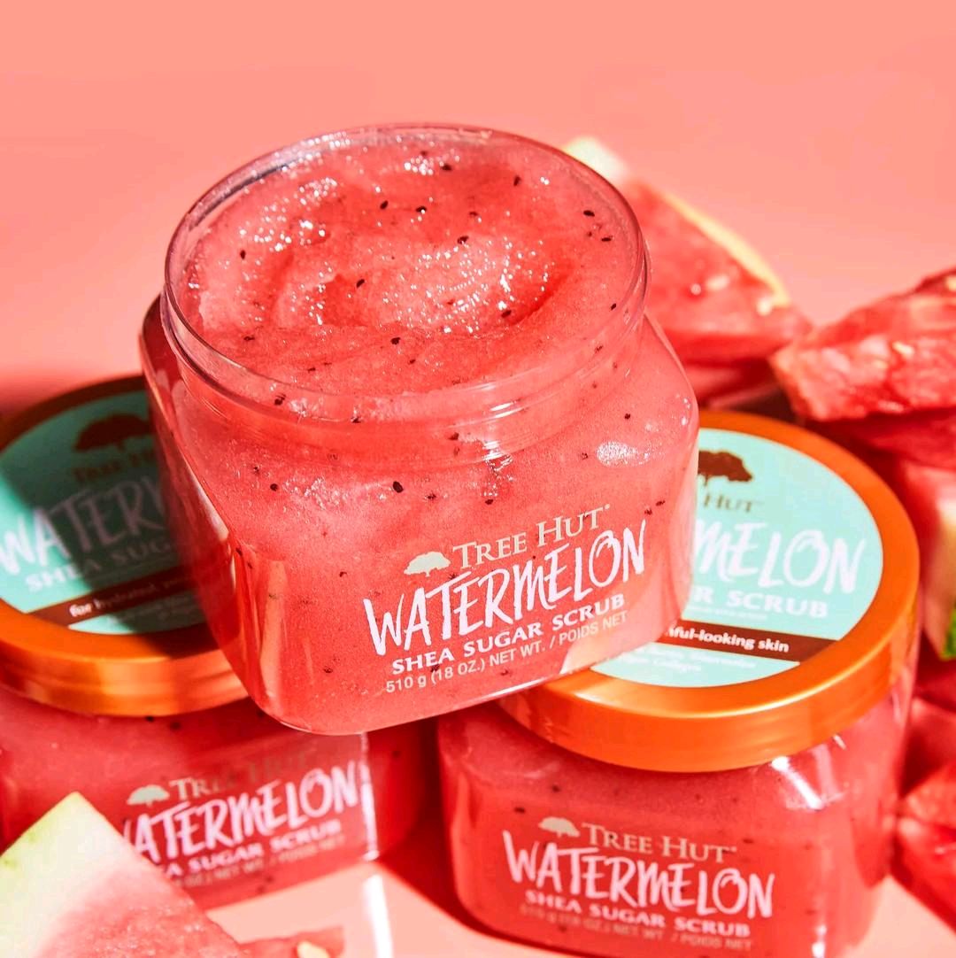 HAMYNAT Tree Hut Watermelon Shea Sugar Scrub in a pink textured jar with fresh watermelon slices on a pink background