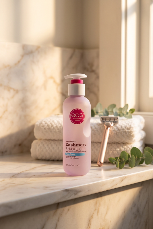 EOS Fresh and Cozy Shave Oil 177ml bottle with a razor and white towels on a marble surface
