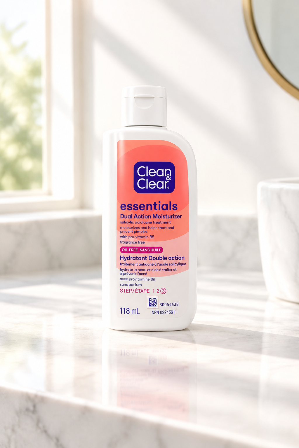 Clean and Clear Essentials Dual Action Moisturizer 118ml bottle on a marble countertop