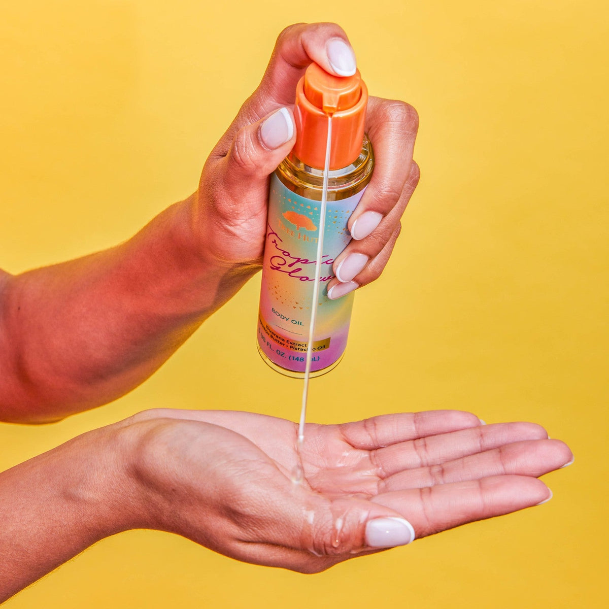 Body oil dispensed into palm
